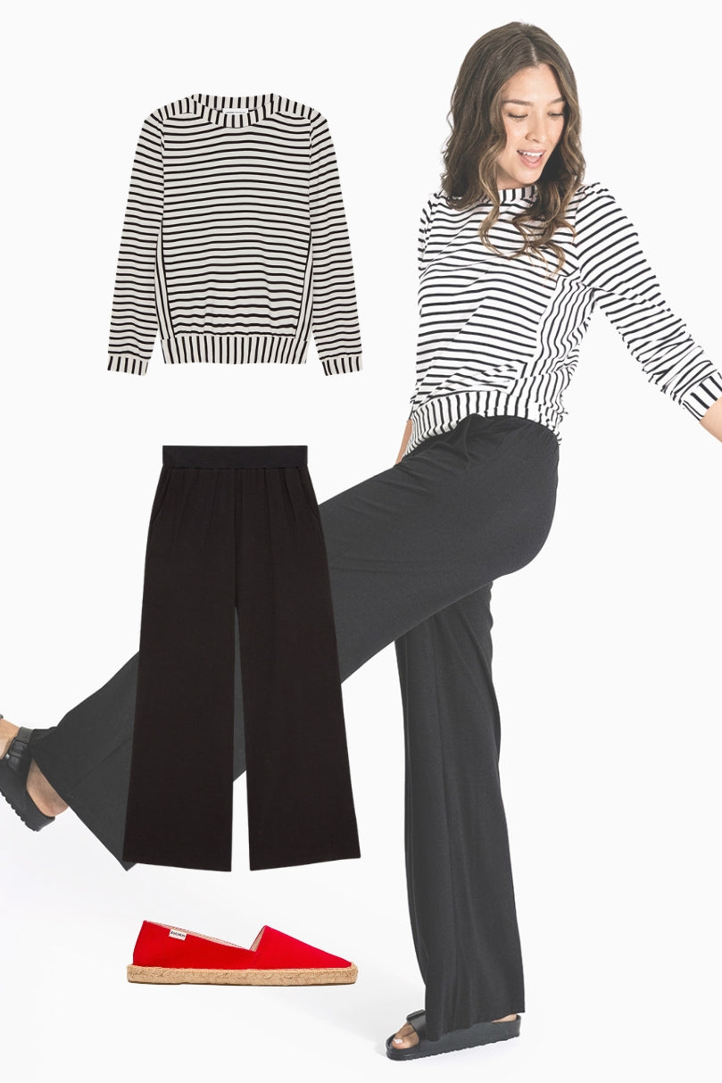 Model wearing black Vivian wide-leg pants with a black and white striped top  | Palazzo Pant for Women | Comfortable Wide Leg Pants | Black Knit | Lacson Ravello